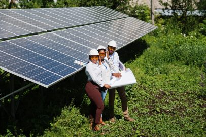 african american technician checks maintenance solar panels group three black engineers meeting solar station 2 scaled e1772462050302